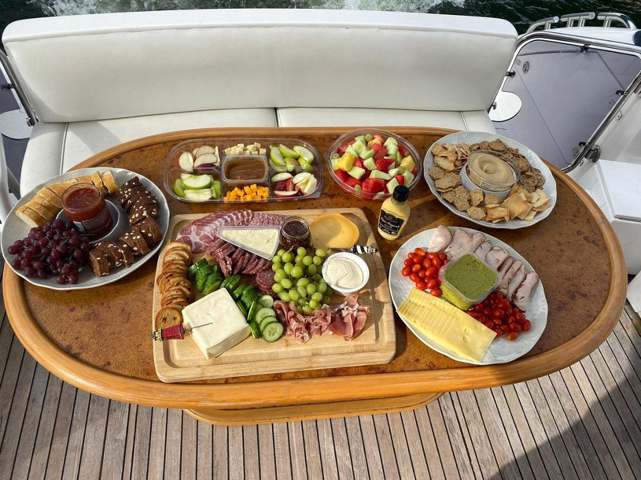 food on table on boat in the water