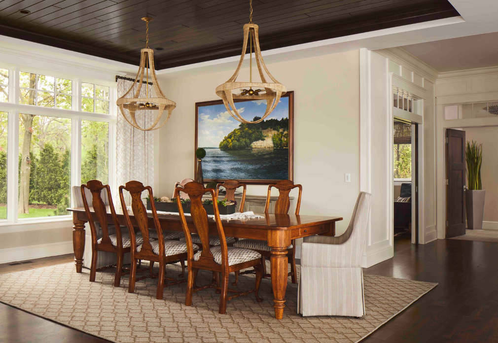 dining room with dark wood-plank ceiling in Lake Nagawicka lake home