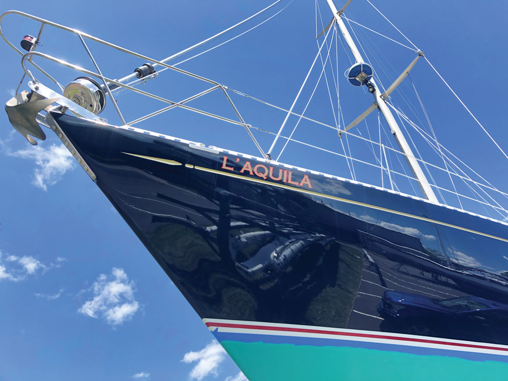 a clean sailboat with the name 'LAQUILA