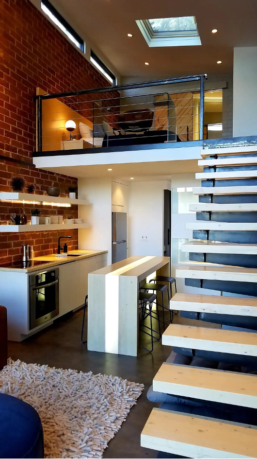 loft space inside modern tiny lake home