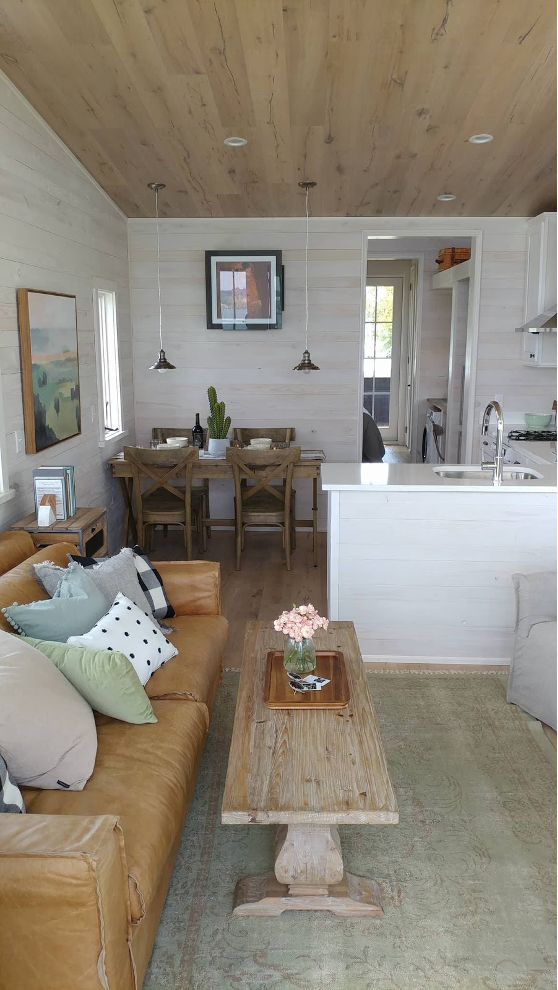 tiny lake home kitchen, dining room, and living room with open floor plan