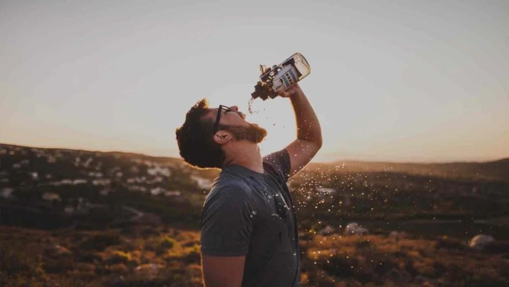 Man drinking from water bottle