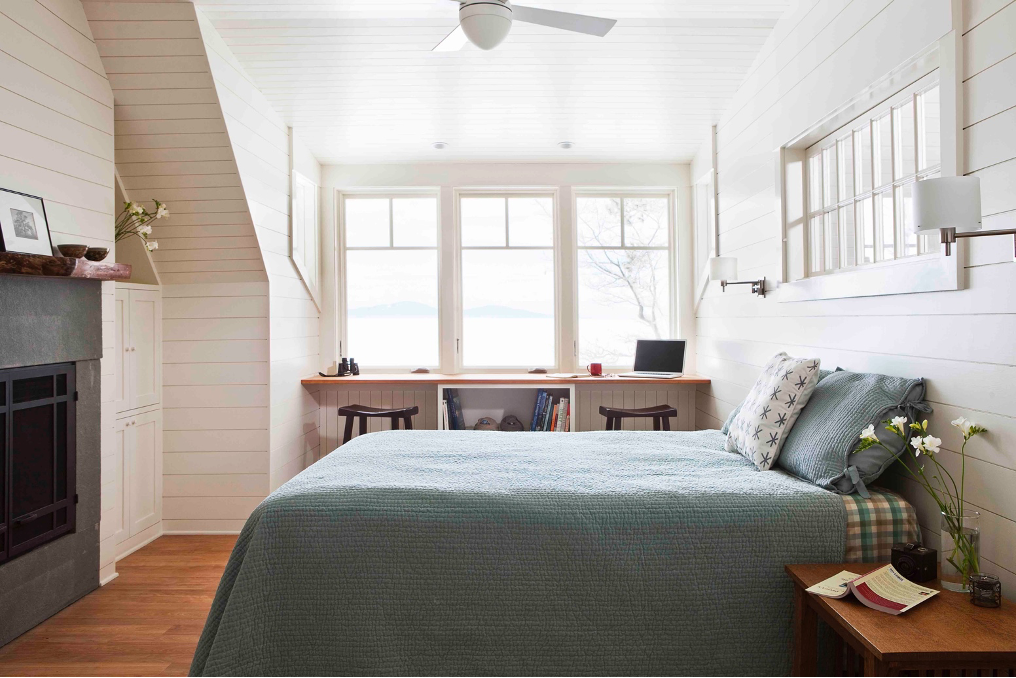 Upstairs bedroom with lake view and fireplace