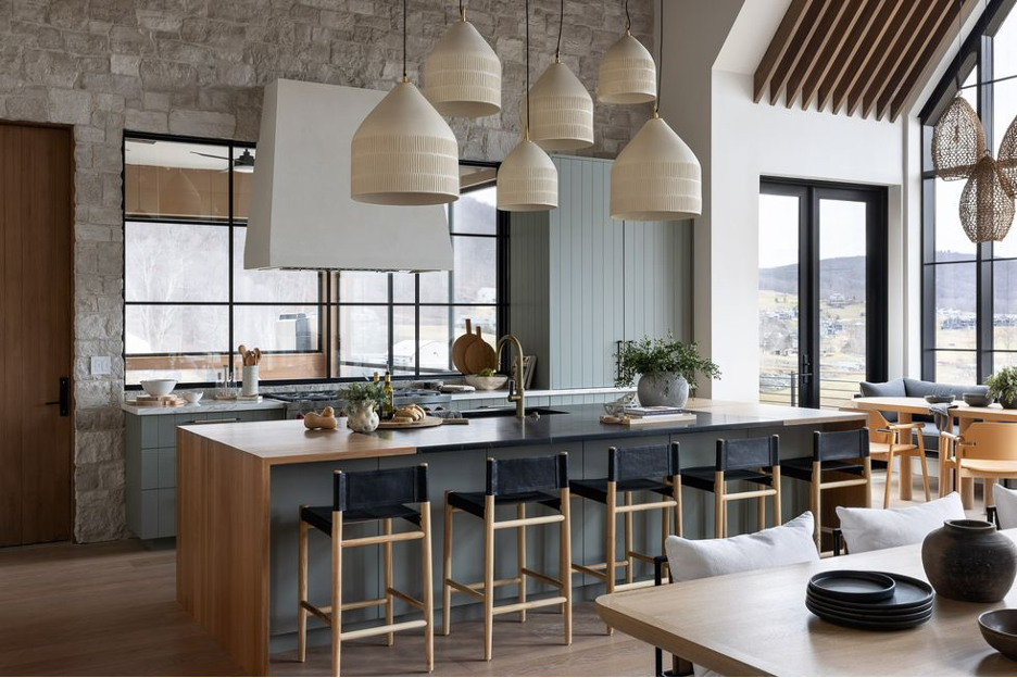 Sculptural pendant lighting at kitchen island and dining area