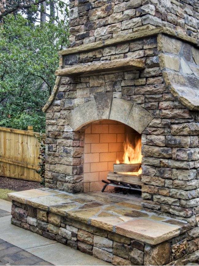 stacked stone outdoor fireplace