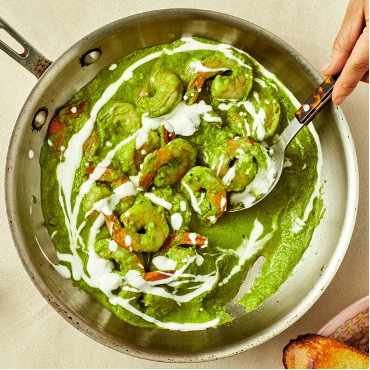 Gorgeous Green Shrimp in a skillet with serving spoon