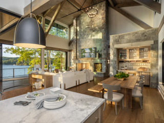 Modern Lake home design 2025 showcasing open floorplan integrating kitchen, dining, living room, and outdoor spaces