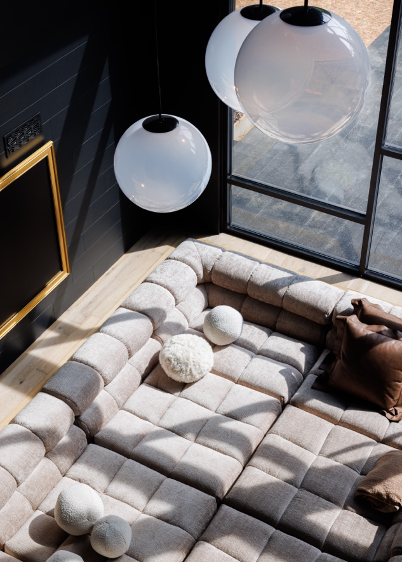 Detail overhead shot of conversation pit with pillows