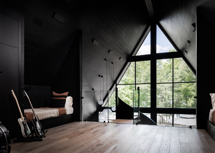 Upstairs loft space with built-in bunk beds, electric guitars and drum set in foreground