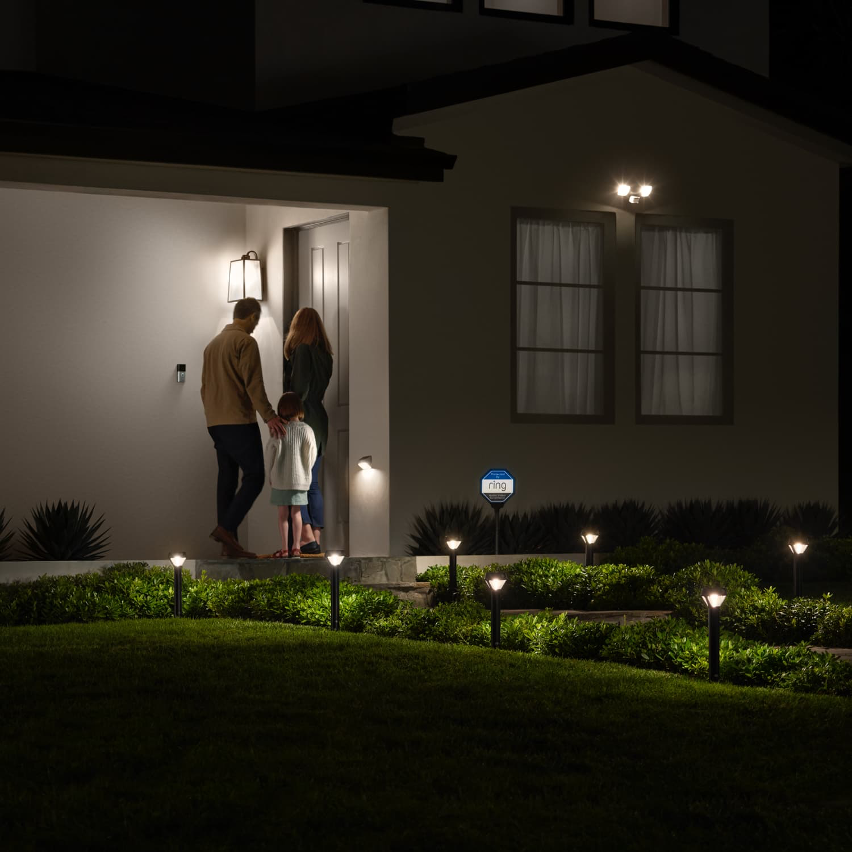 Ring Smart Solar Lights applied to an outdoor environment with landscaping, and people in the background at the door