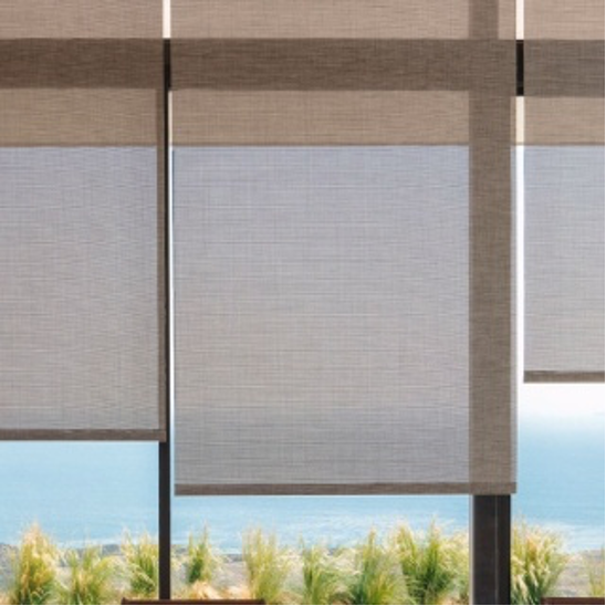 Solar window shades applied in windows overlooking the water and landscape