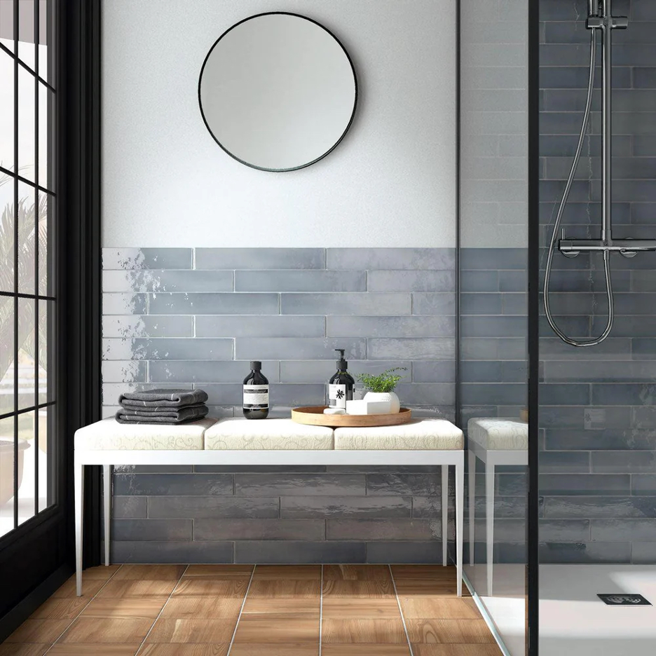 Stylish Subway Tile cladding a lake home bathroom backsplash and shower