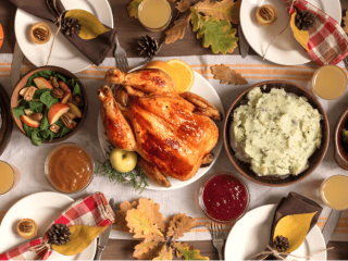 Thanksgiving table with all the foods arranged and styled beautifully