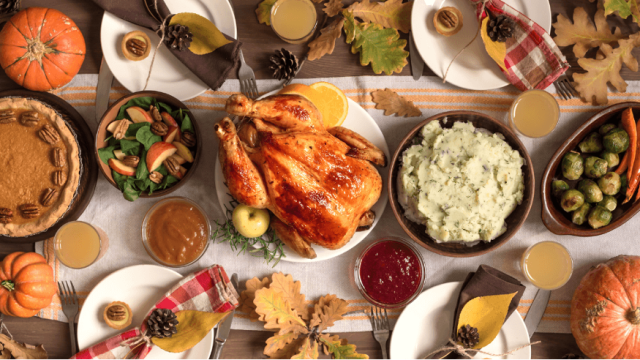 Thanksgiving table with all the foods arranged and styled beautifully
