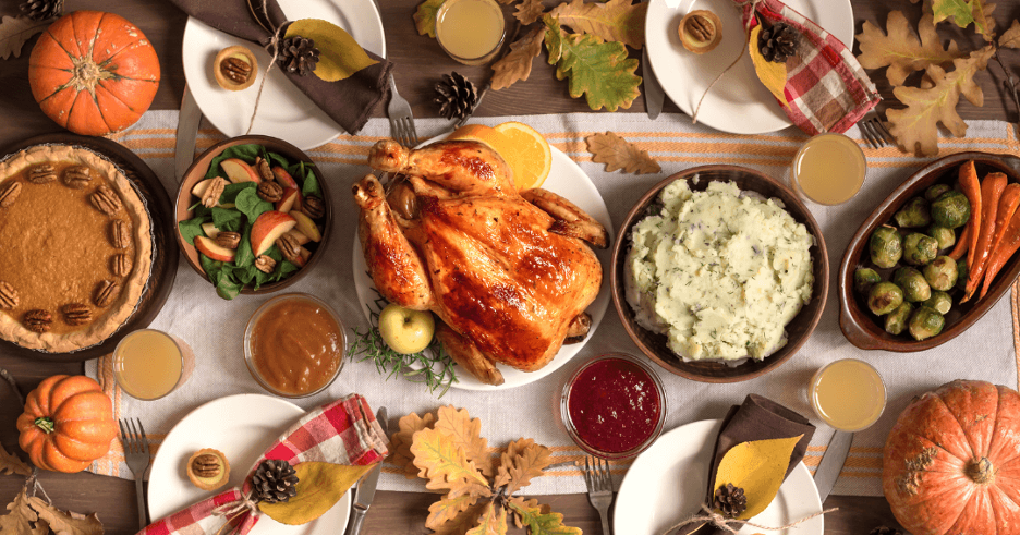 Thanksgiving table with all the foods arranged and styled beautifully