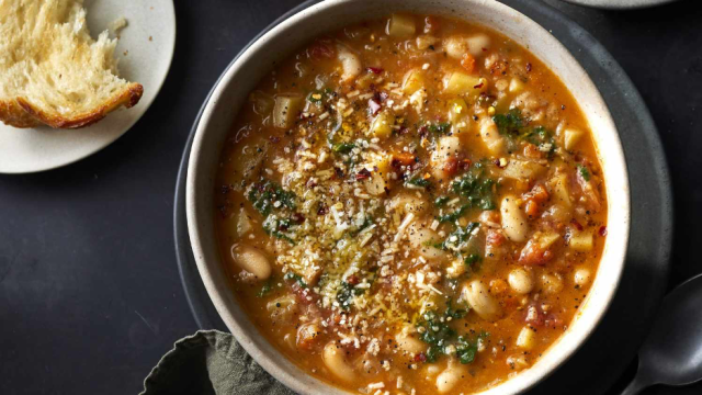 Ribolitta recipe from Food & Wine served in a rustic bowl with bread