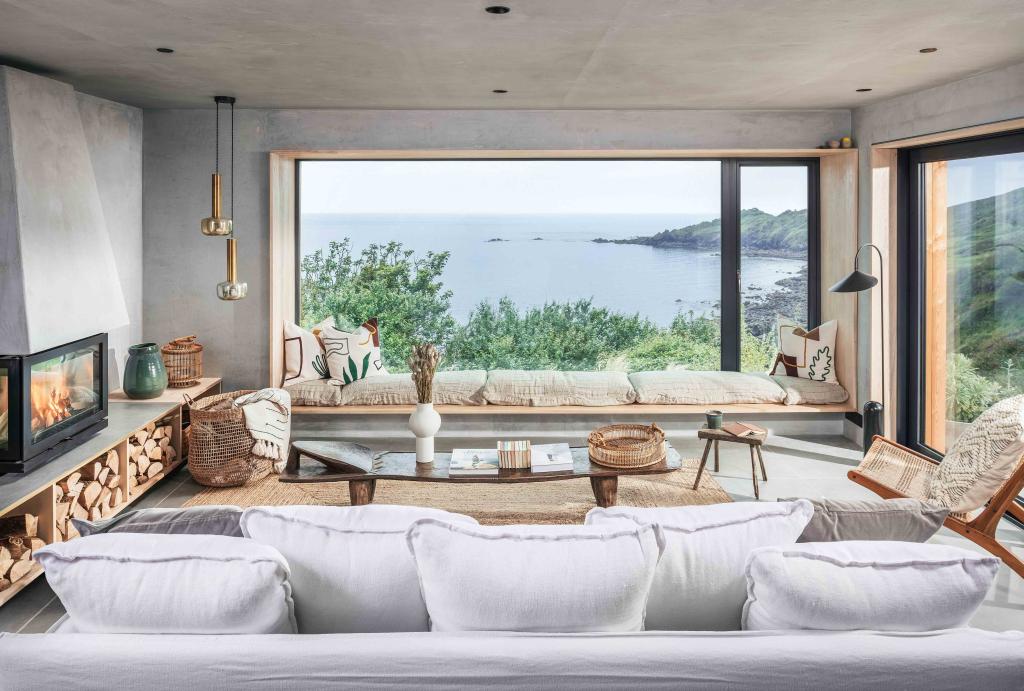 Japandi-style living room with expansive window and water views