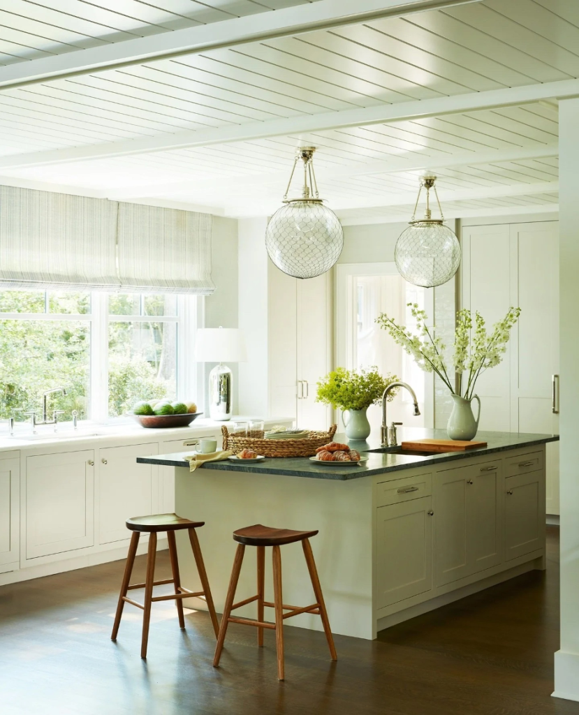 Accent Wal With Rich, Nature-Driven Color in shades a subtle green in a lake home kitchen
