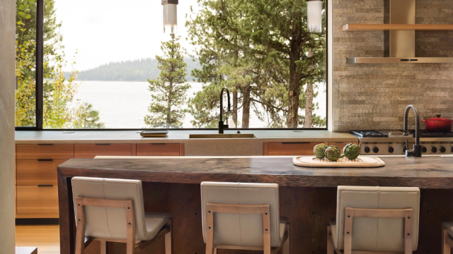 Beautiful modern kitchen in a lake home with a beautiful lake view above the kitchen sink