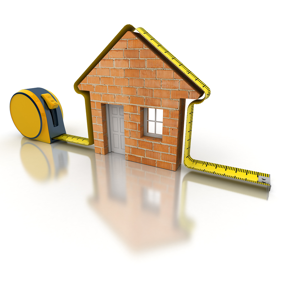 tape measure around a brick home facade illustrating why accurate square footage is important