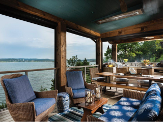 Rustic covered porch overlooking the lake