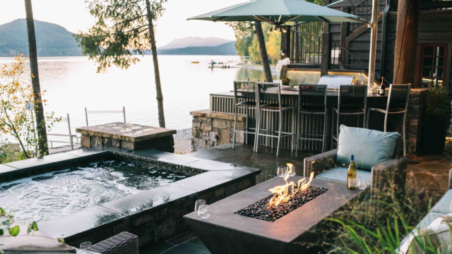 Luxurious outdoor living space at a lake home on Whitefish Lake, Montana, by White Cloud Design.